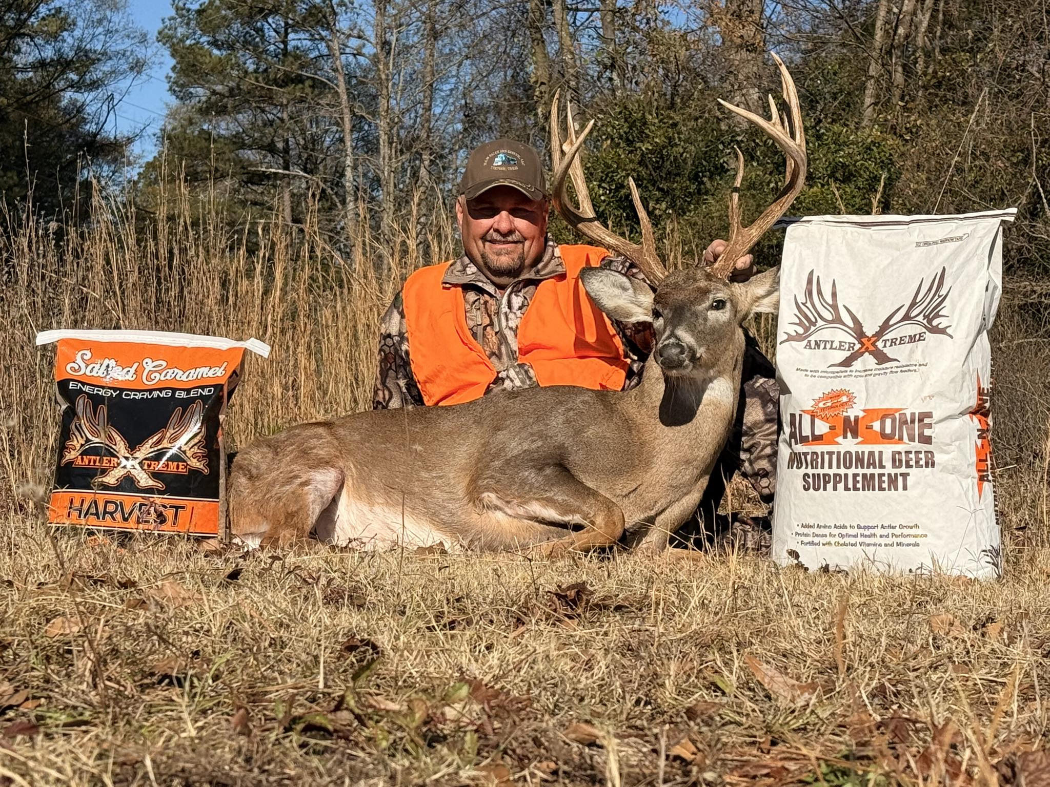 Sam Wilbanks with mature whitetail buck after using AntlerXtreme feed in Georgia